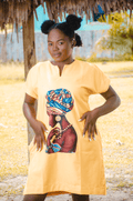 African woman wearing a yellow dress with vibrant graphic print of an African woman with a colorful head wrap Afrocentric fashion, culture, and heritage-inspired clothing Carl-Winston